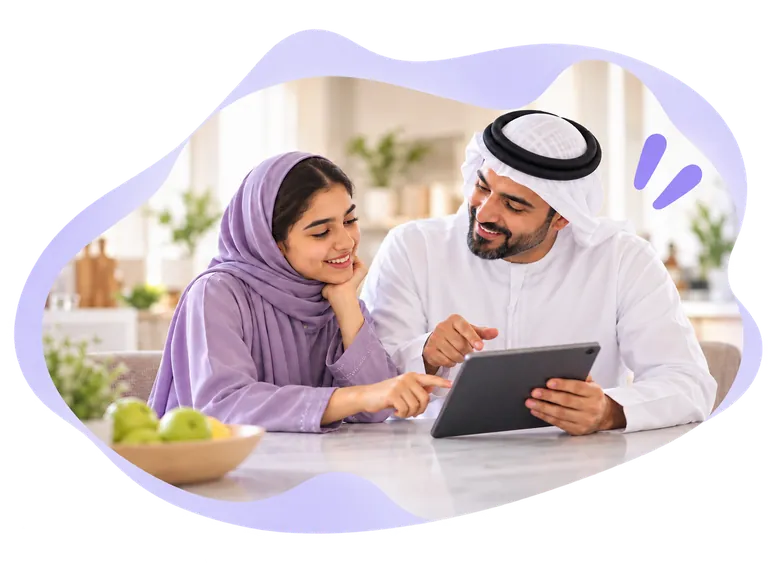 A father and teenage daughter planning a savings goal together
